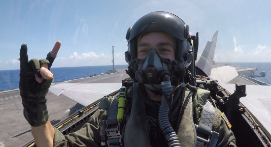 Tyler of Tyler Wilson taking off an aircraft carrier in an F/A-18F Super Hornet